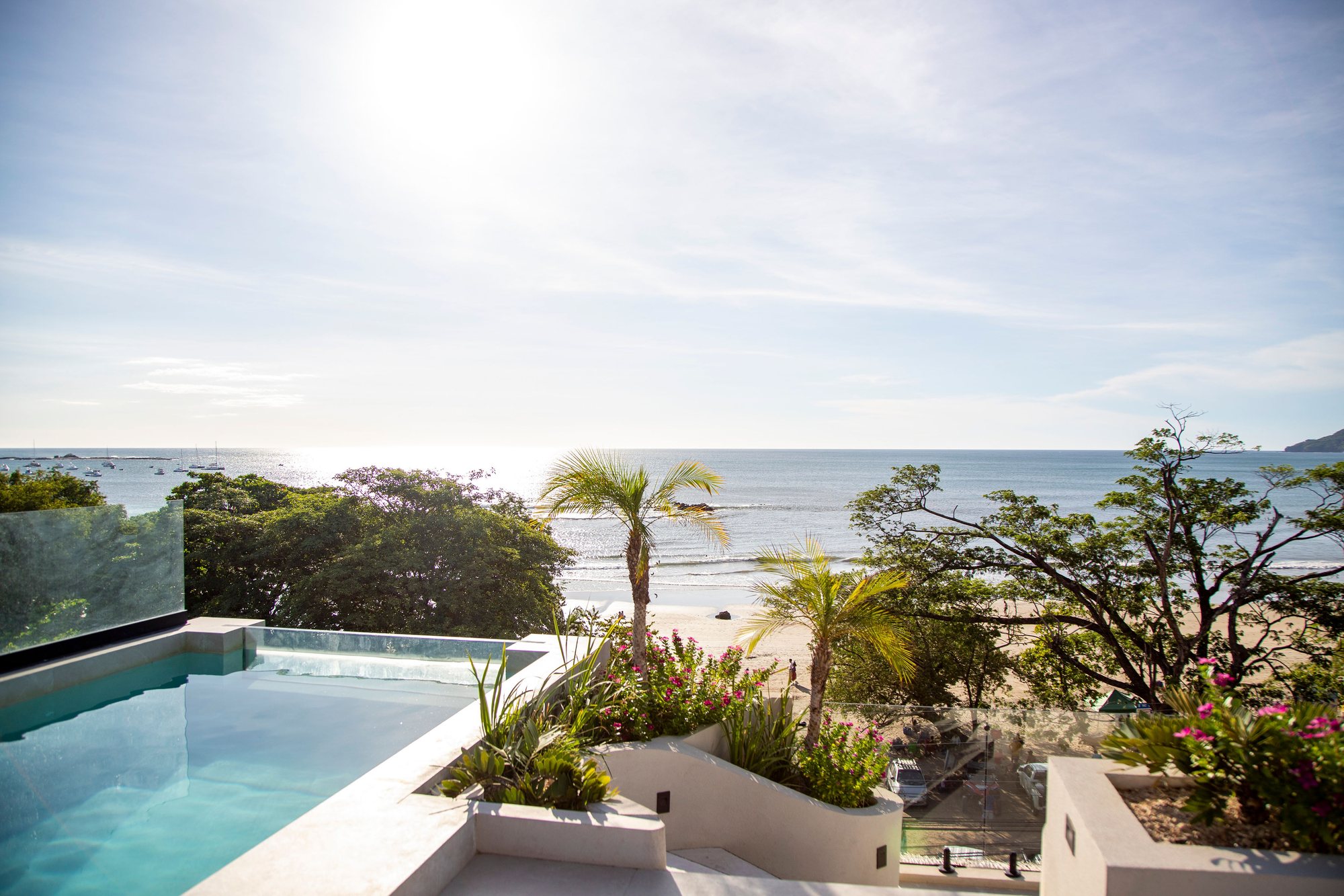 Naia's rooftop pool in bright daylight, overlooking the Pacific