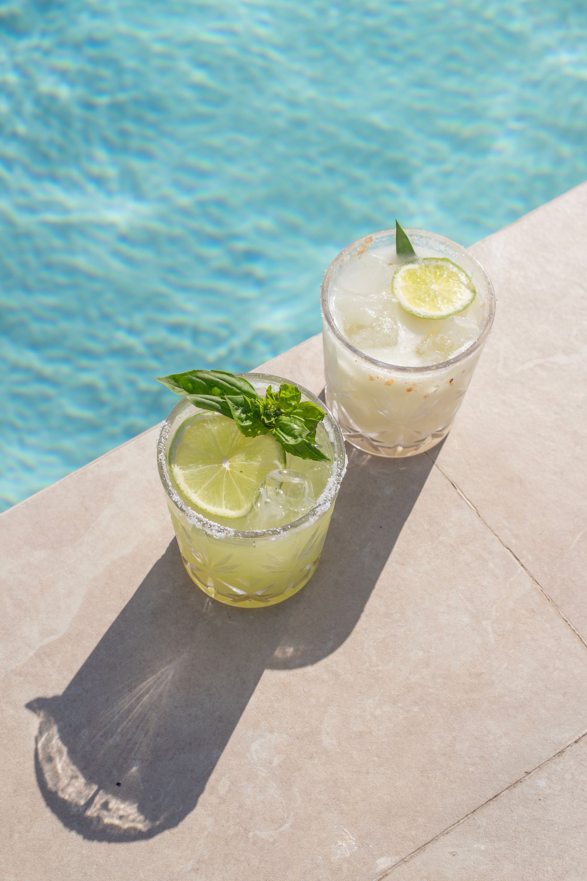 Cocktails set at the edge of Naia's rooftop pool