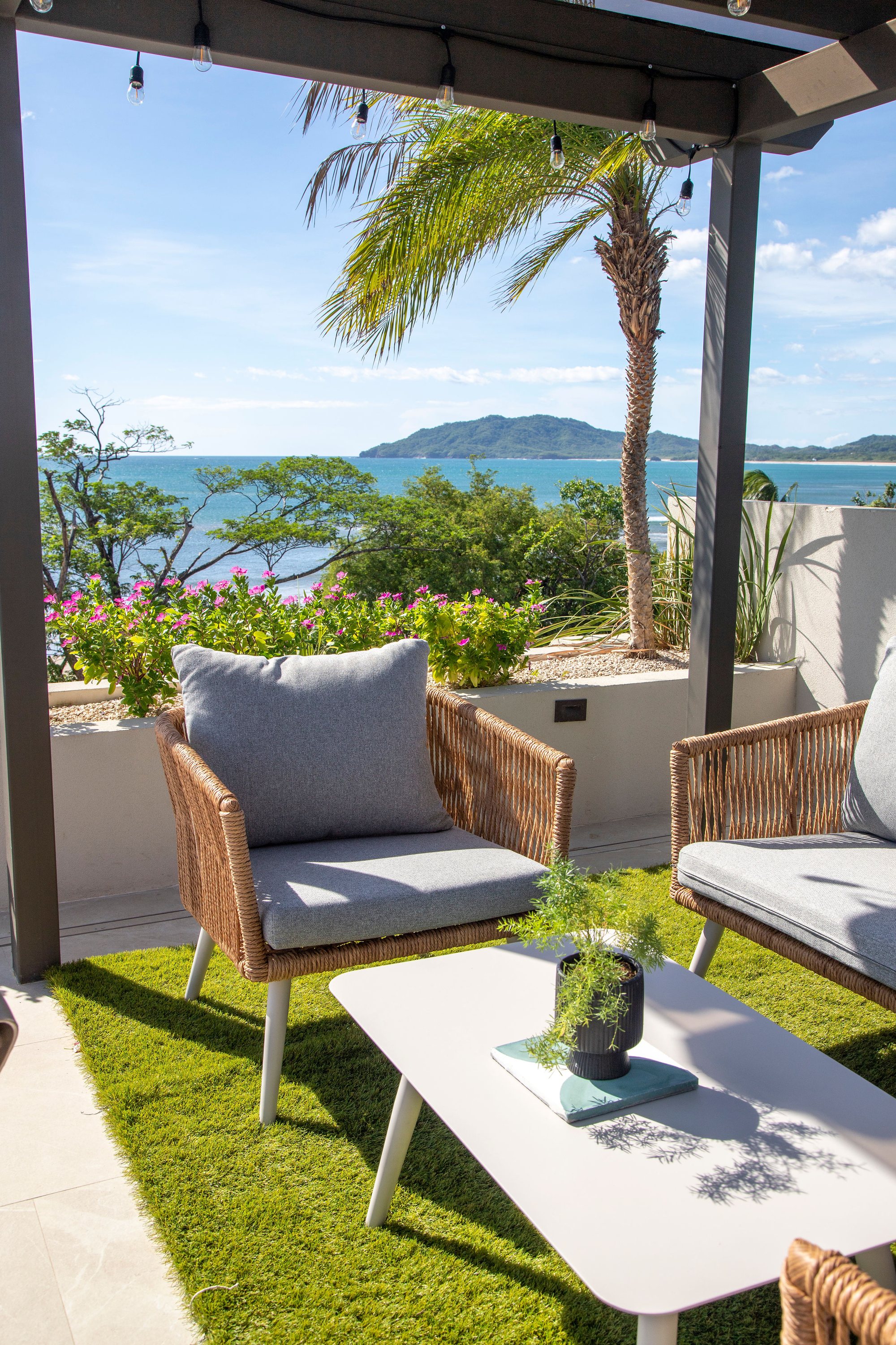 Naia's rooftop lounge seating overlooking Tamarindo in daylight