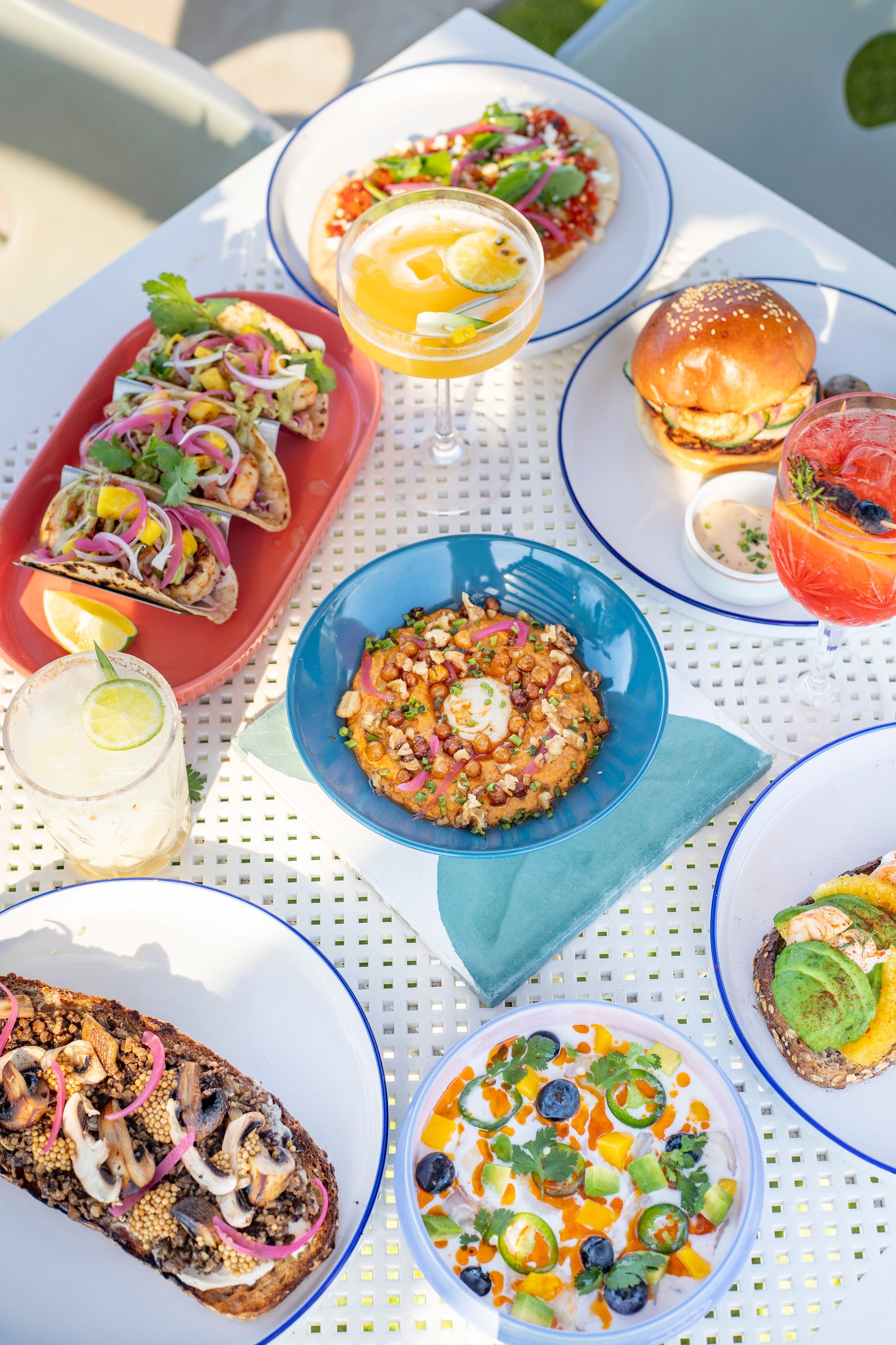 A shared spread of Naia dishes, overhead view
