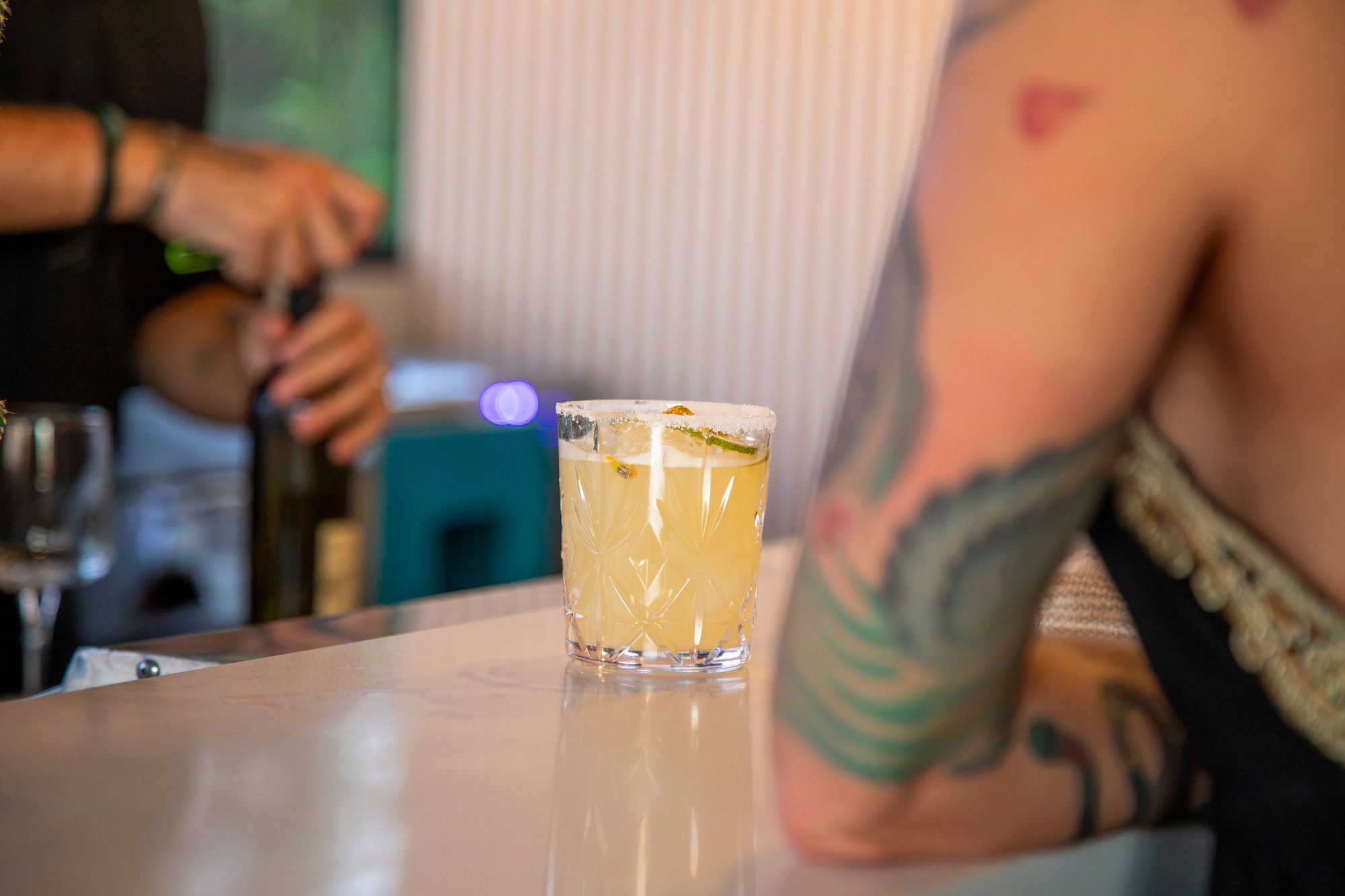 A bartender preparing a cocktail