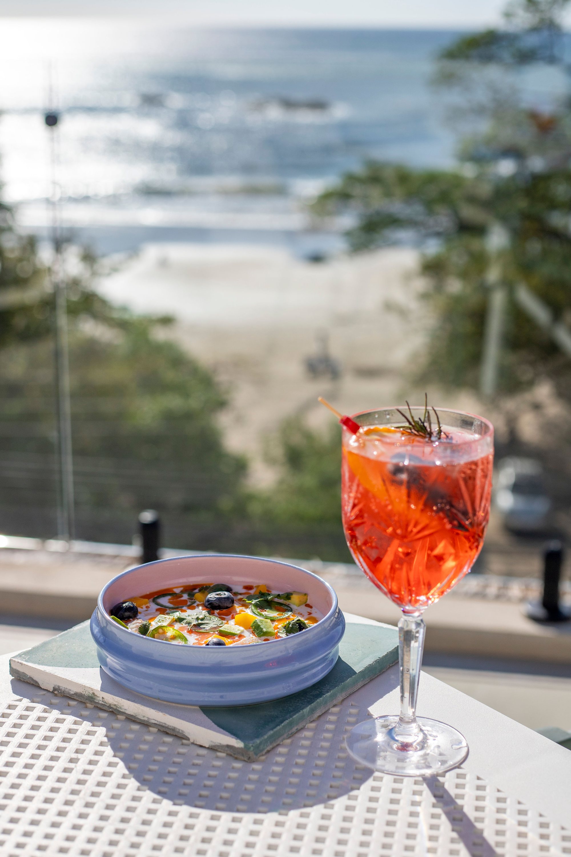 A cocktail with a rooftop view